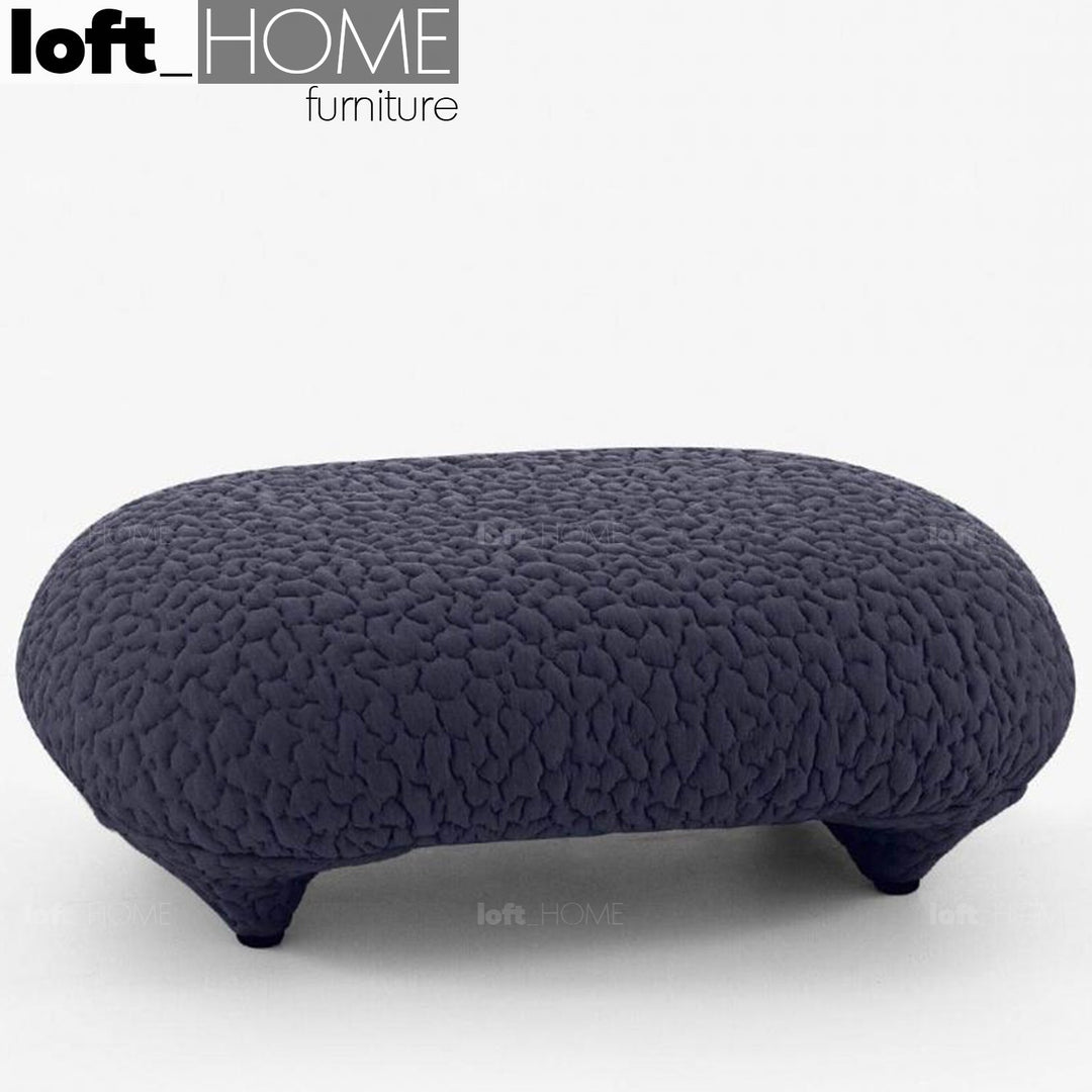 Contemporary fabric ottoman conch moby in panoramic view.
