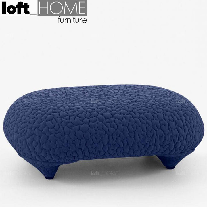 Contemporary fabric ottoman conch moby in details.