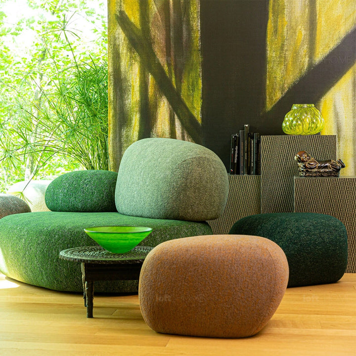 Contemporary fabric ottoman pebble in panoramic view.