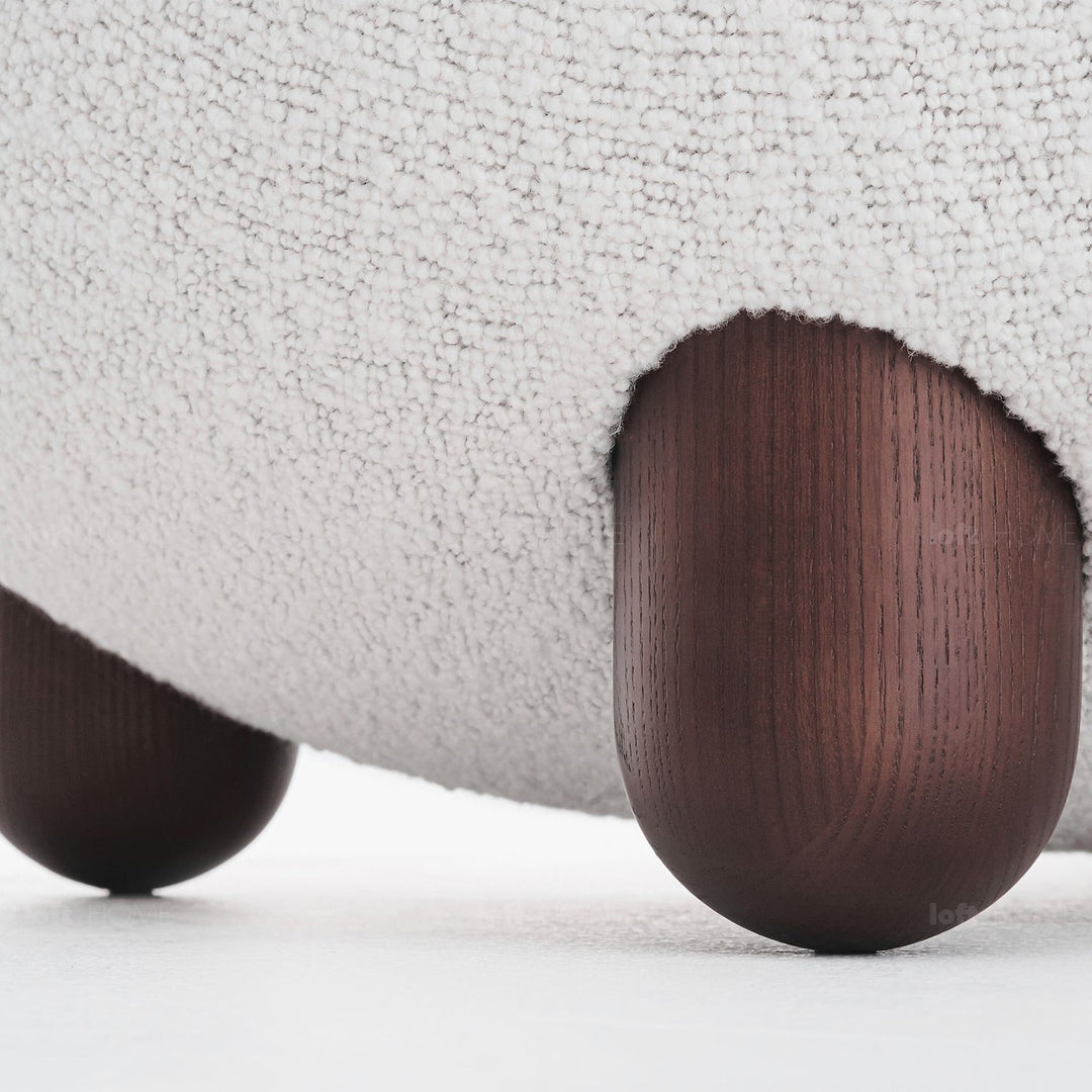 Contemporary fabric ottoman teddy with context.