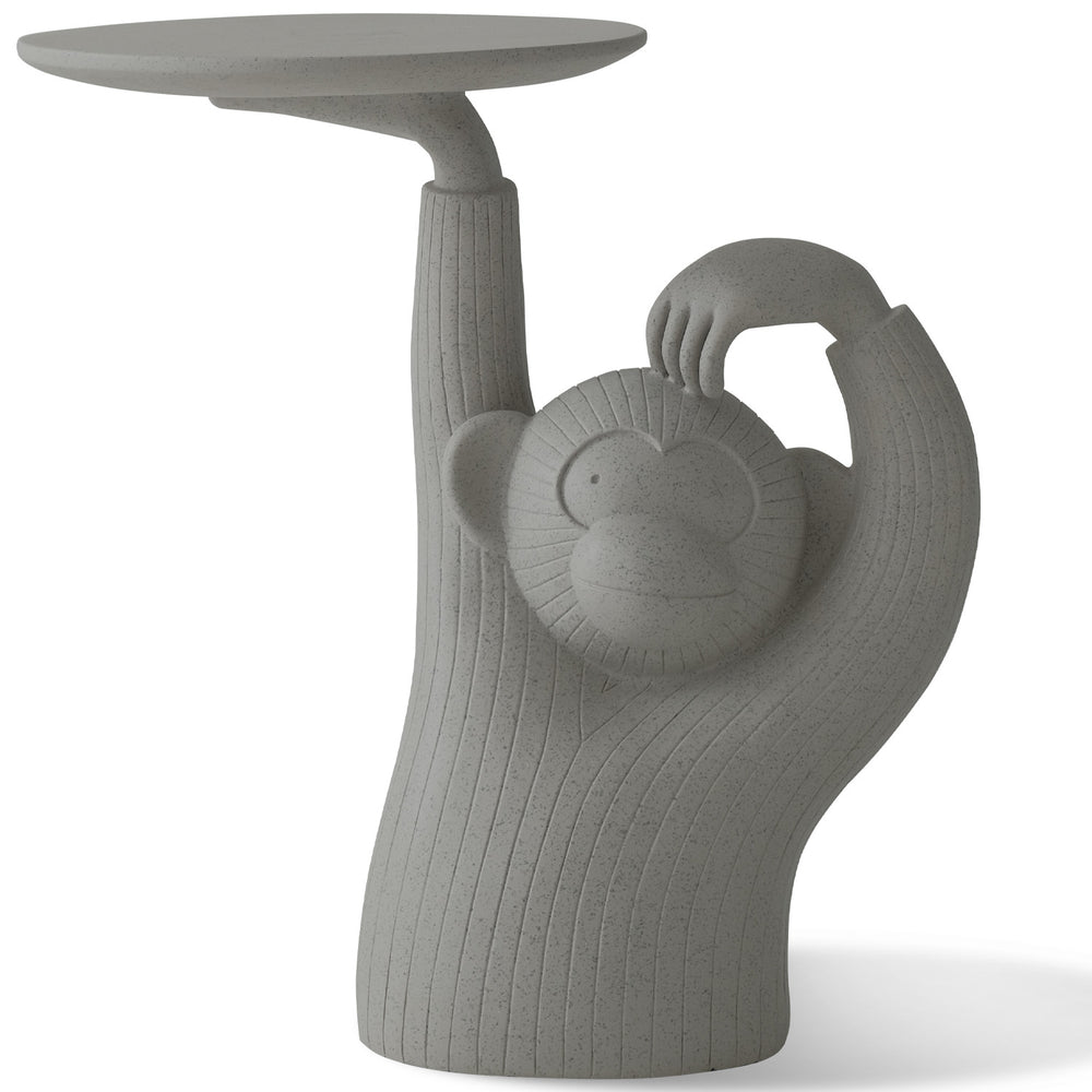 Contemporary fiberglass side table monkey in white background.