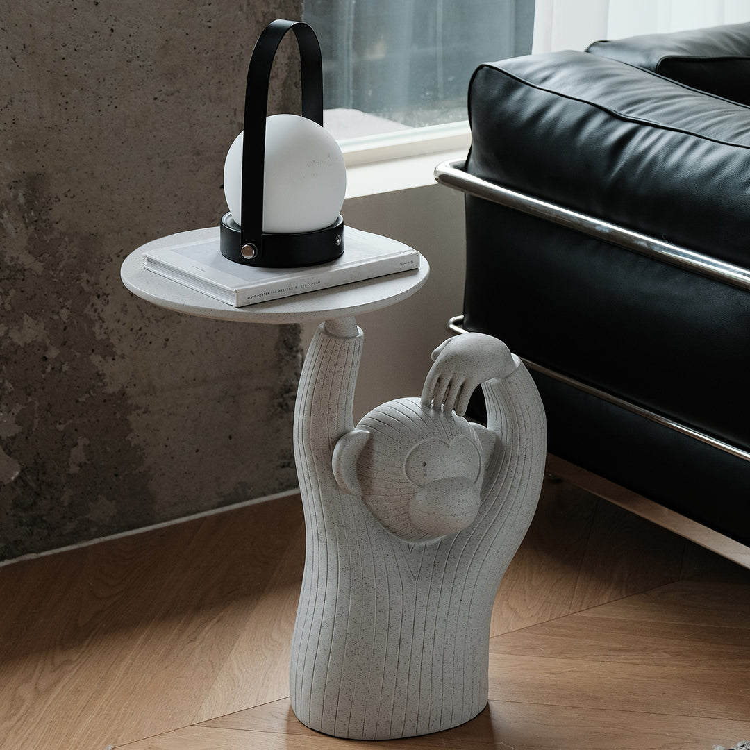 Contemporary fiberglass side table monkey in real life style.