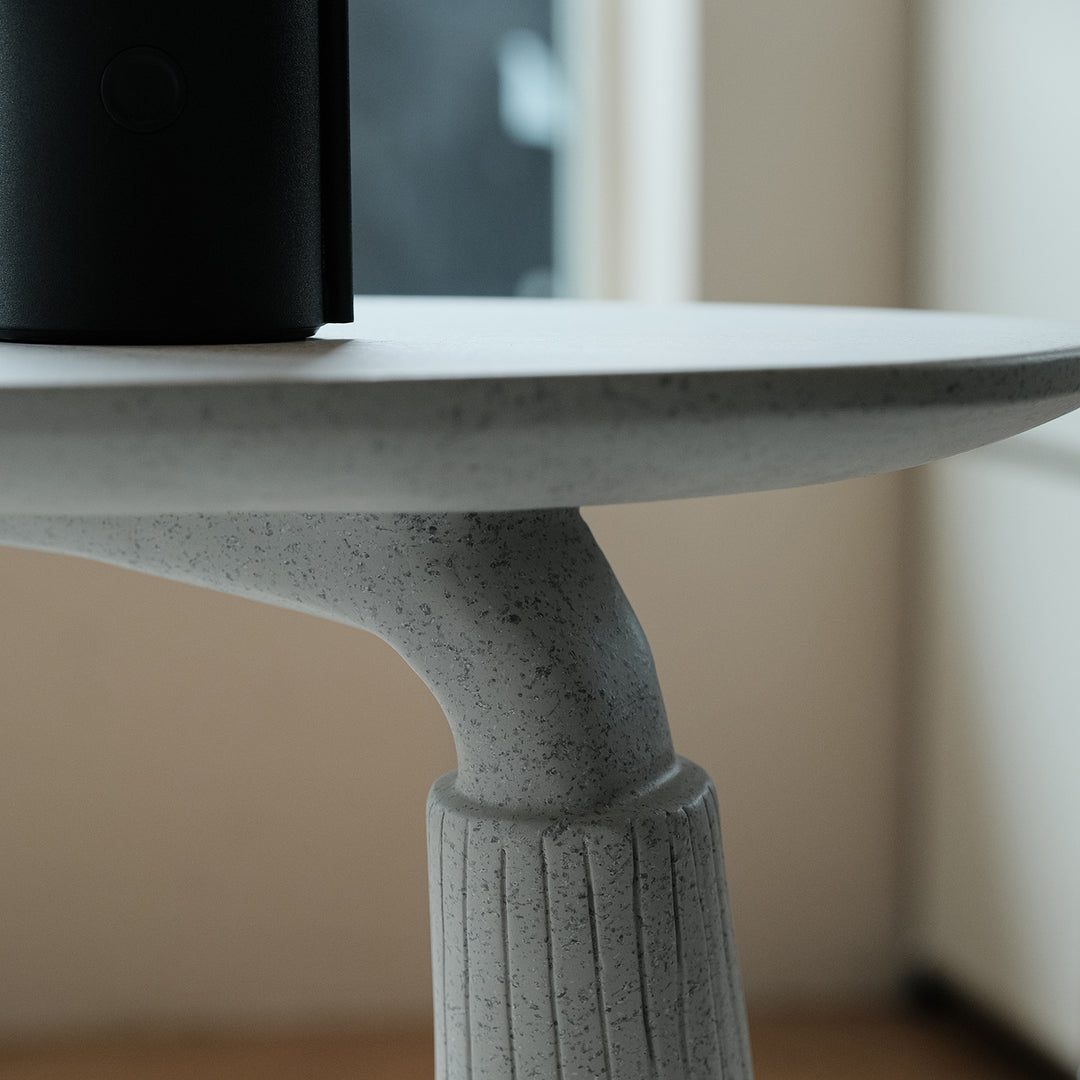 Contemporary fiberglass side table monkey in details.