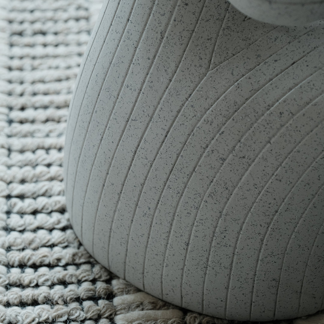 Contemporary fiberglass side table monkey in close up details.
