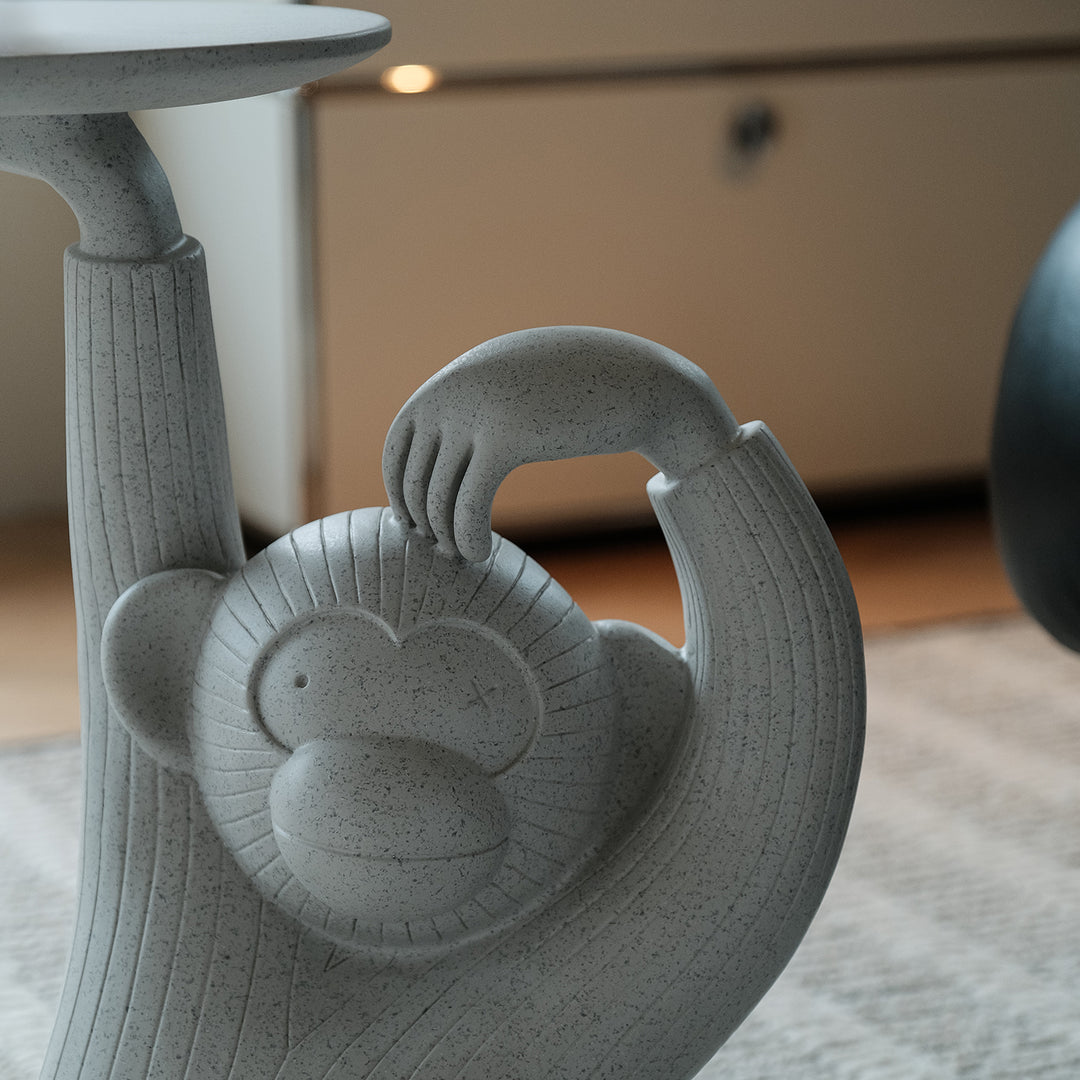 Contemporary fiberglass side table monkey in panoramic view.