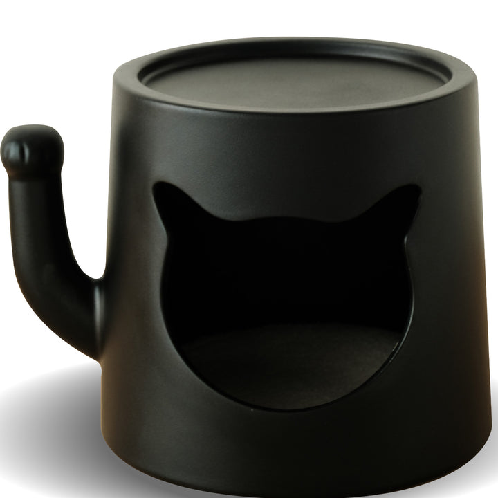 Contemporary plastic side table cat house in still life.