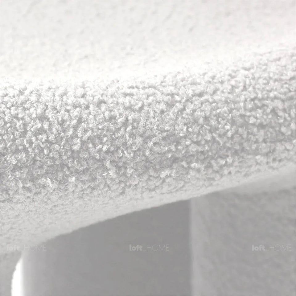 Cream boucle 1 seater sofa elephant in close up details.