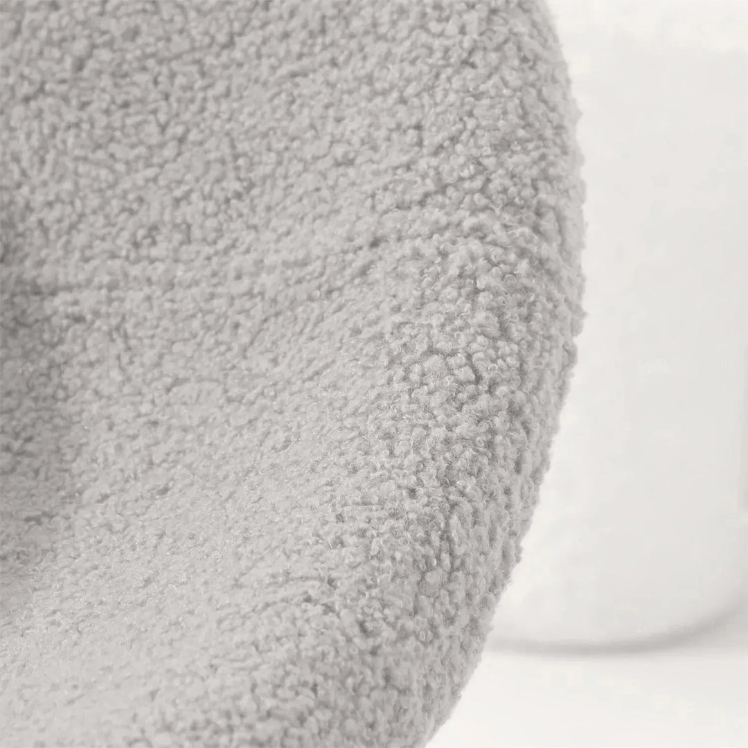 Cream boucle 1 seater sofa mibster in close up details.
