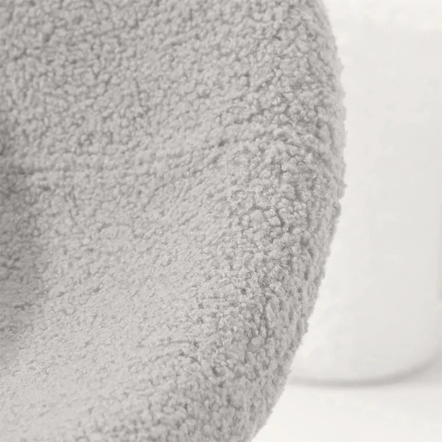 Cream boucle 1 seater sofa mibster in close up details.