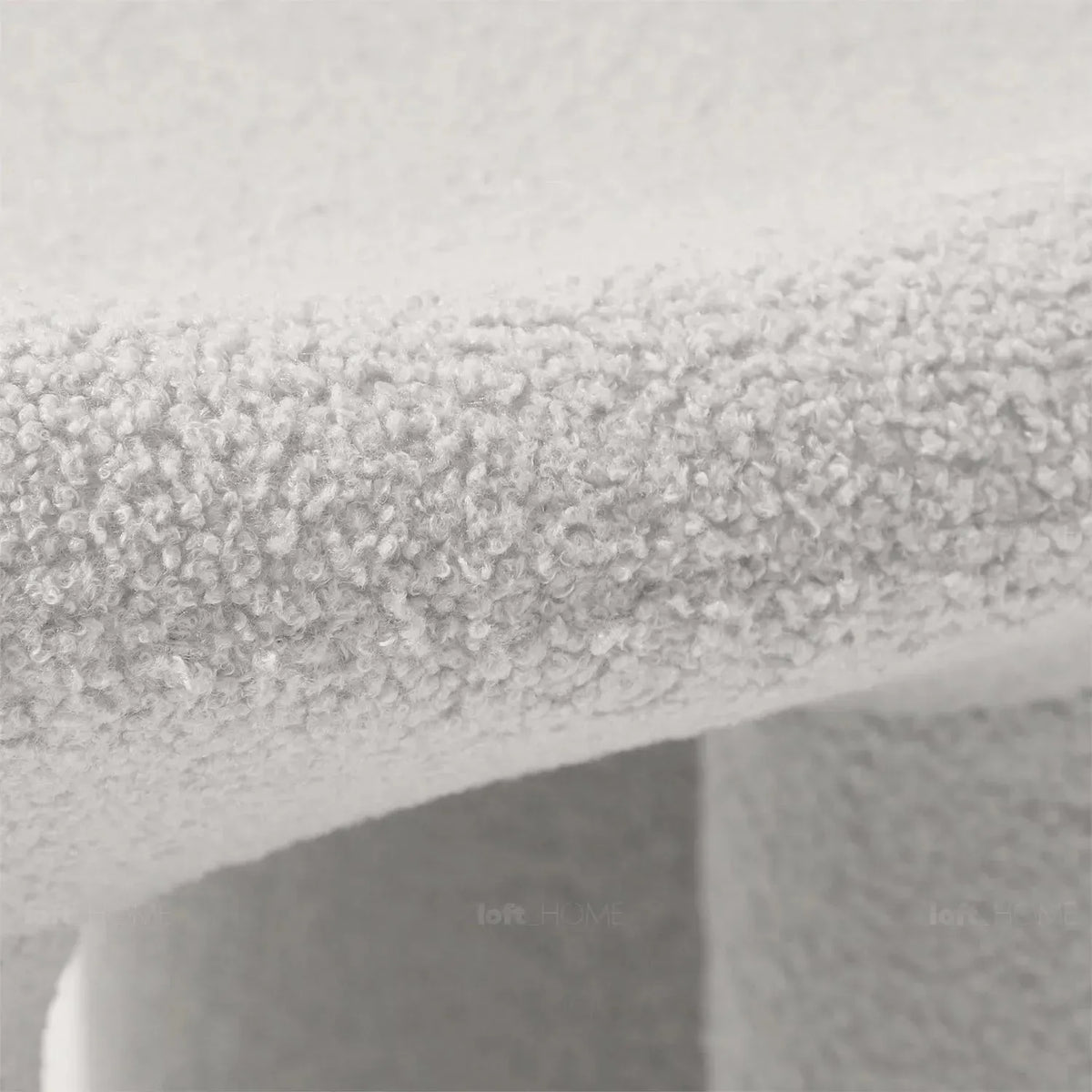 Cream boucle 1 seater sofa mibster in details.