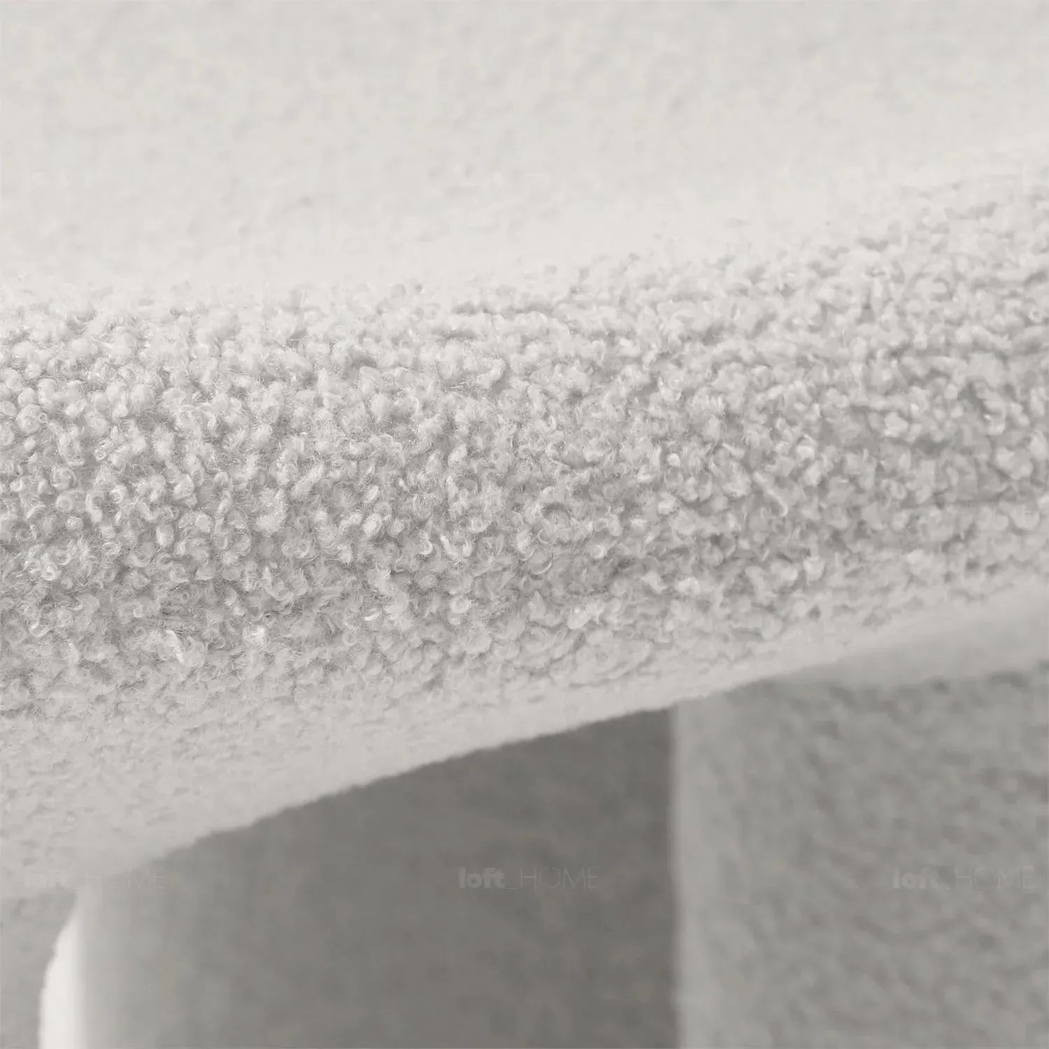 Cream boucle 1 seater sofa mibster in details.