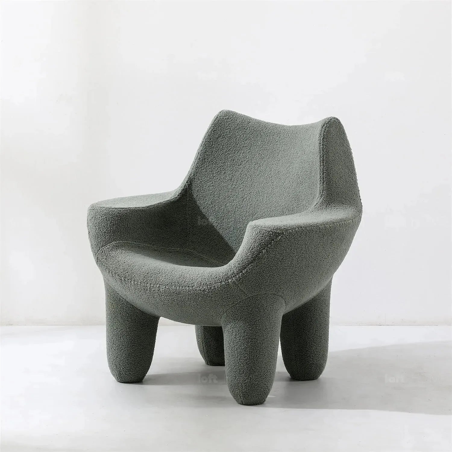 Cream boucle 1 seater sofa mibster in still life.