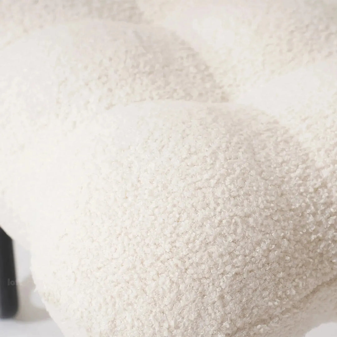 Cream boucle 1 seater sofa souffle in panoramic view.