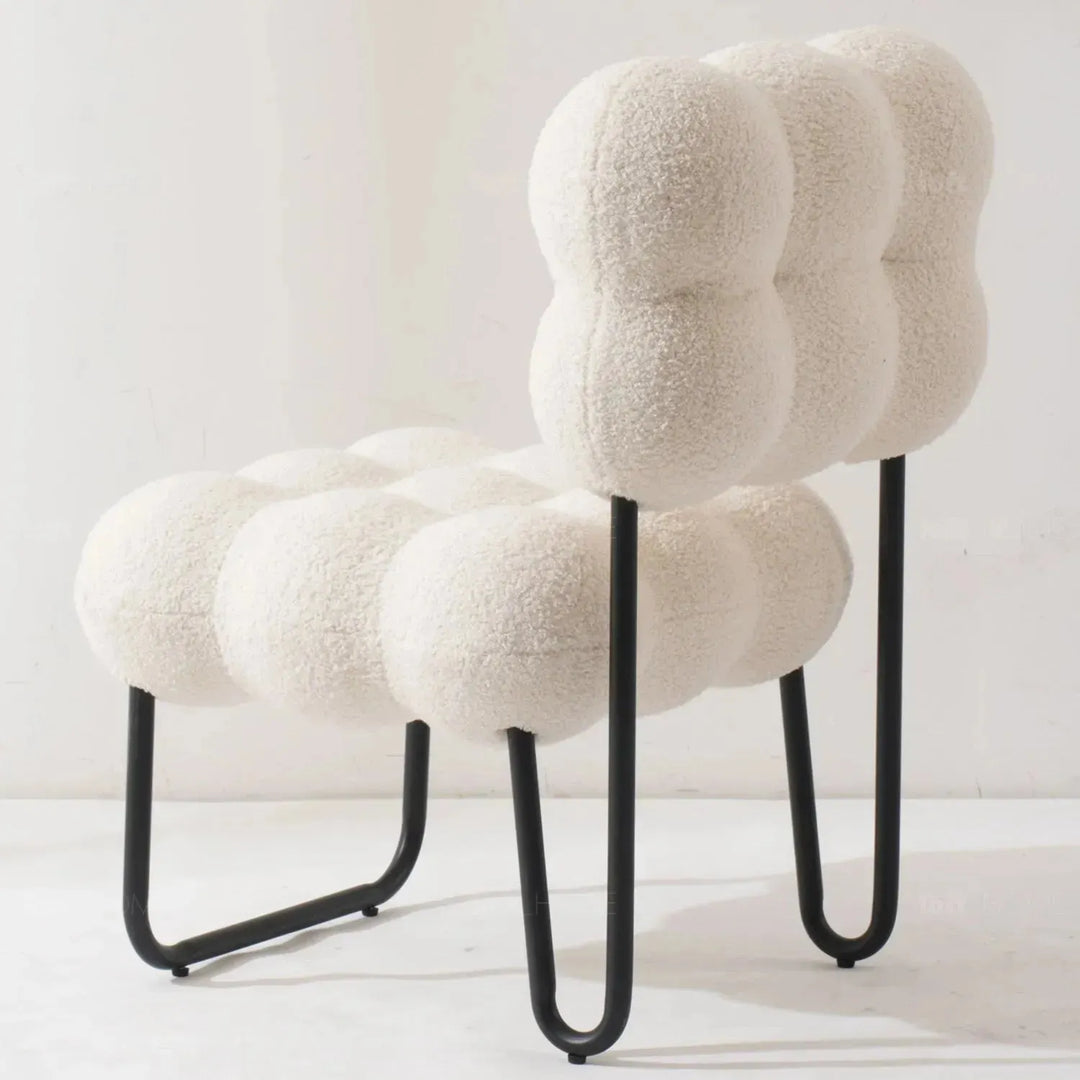 Cream boucle 1 seater sofa souffle in details.