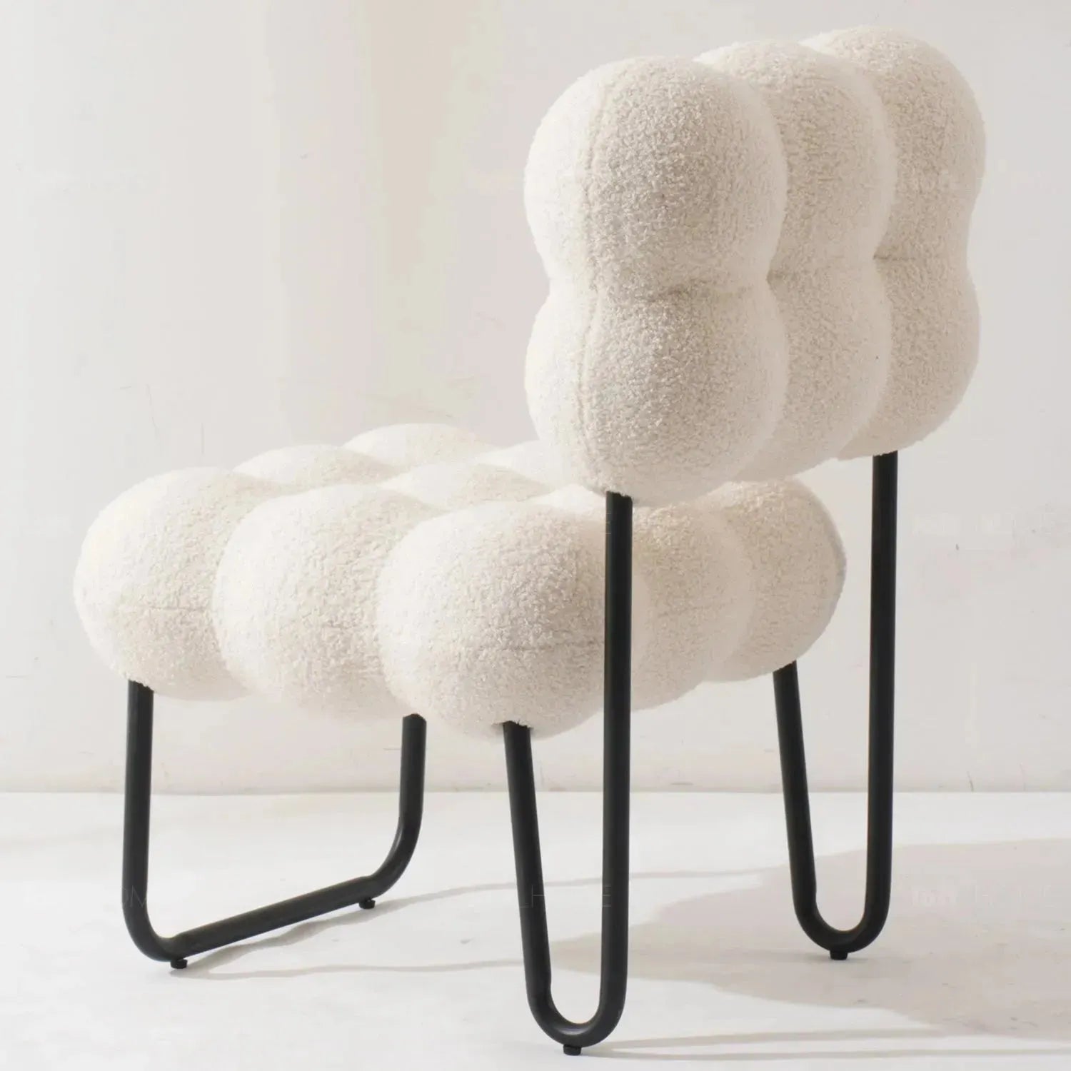 Cream boucle 1 seater sofa souffle in details.