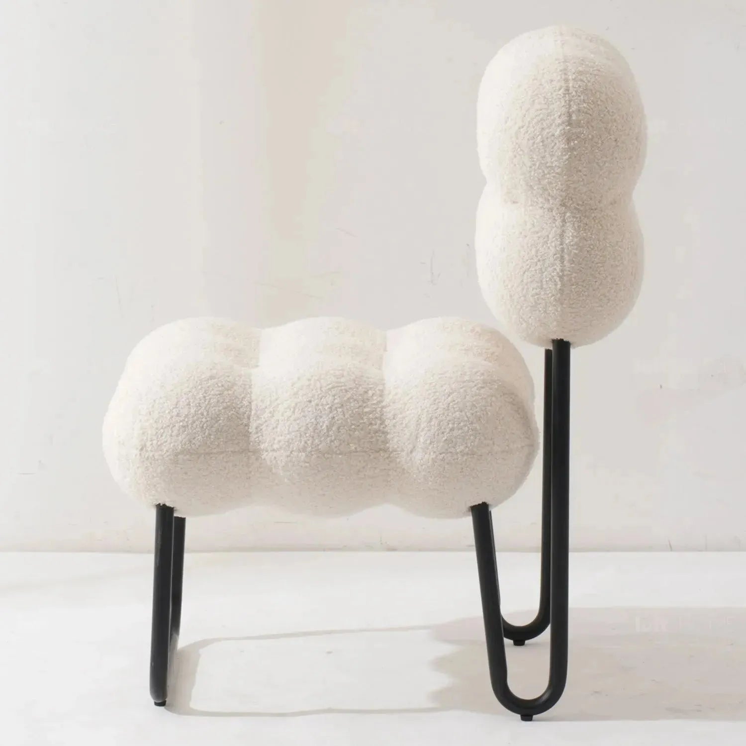 Cream boucle 1 seater sofa souffle with context.