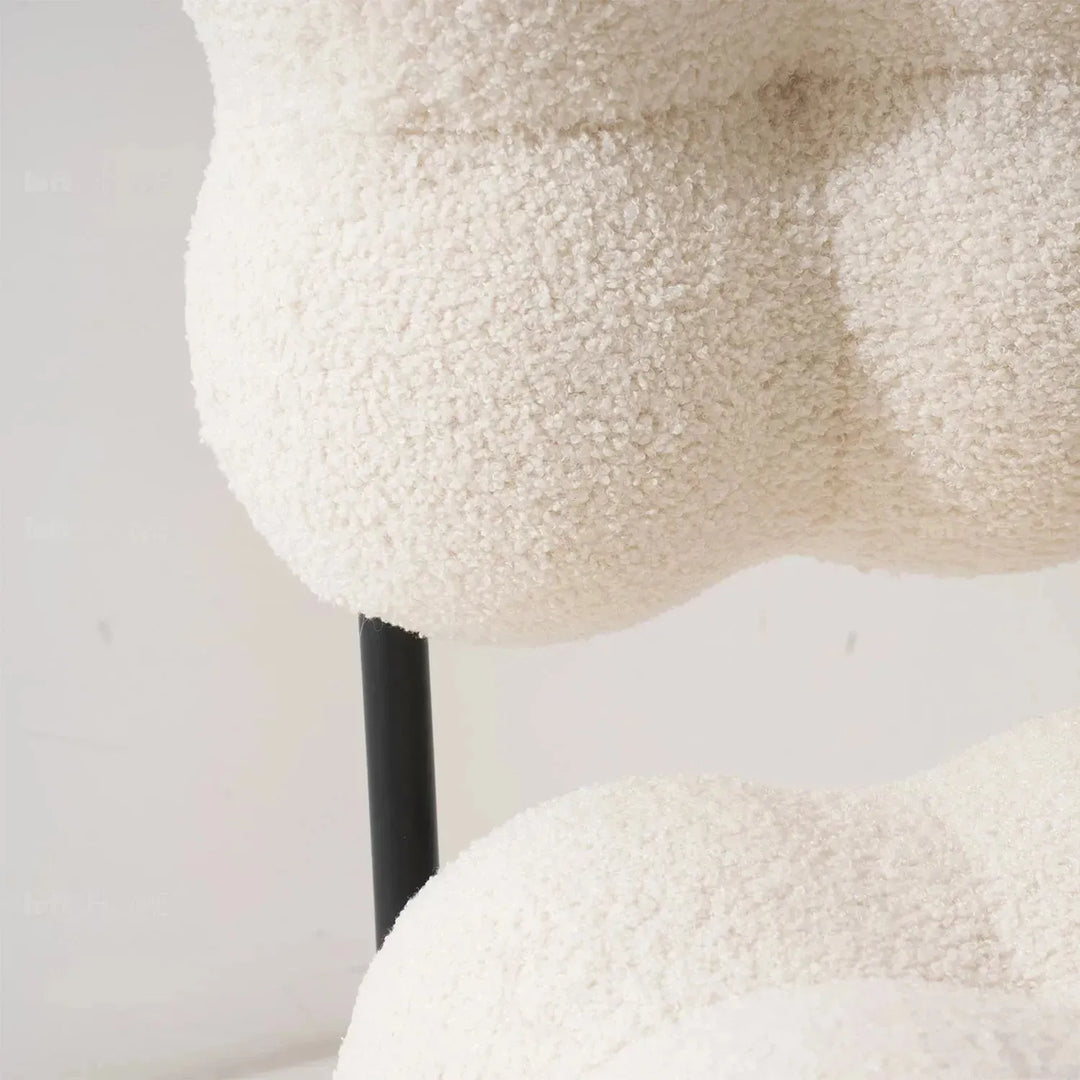 Cream boucle 1 seater sofa souffle in still life.