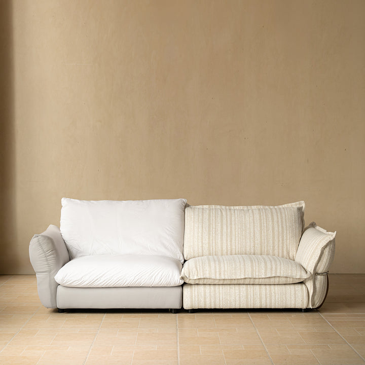 Cream boucle fabric 3 seater sofa circle in still life.