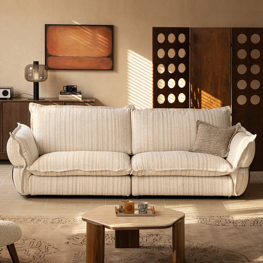 Cream boucle fabric 3 seater sofa circle with context.