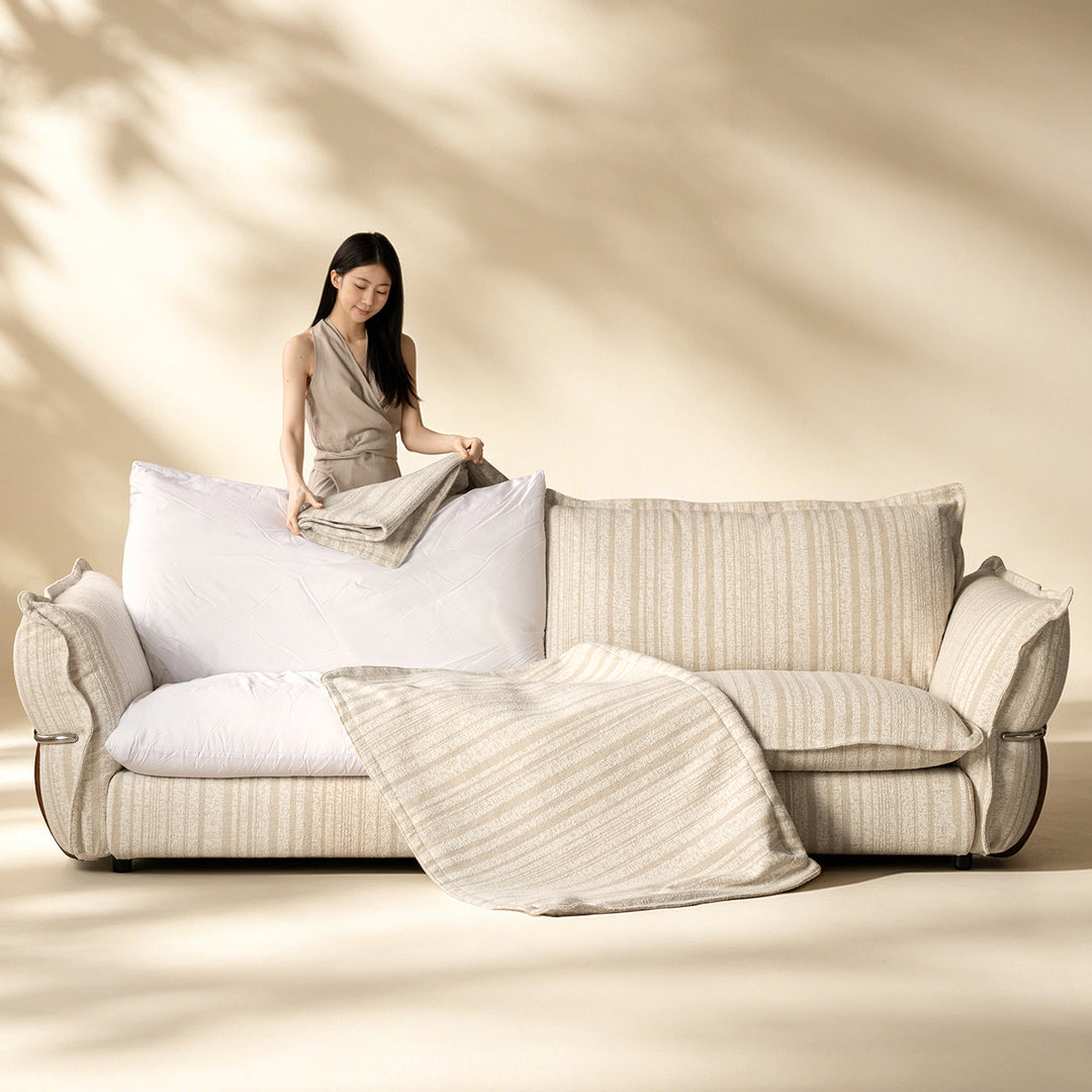 Cream boucle fabric 3 seater sofa circle in panoramic view.
