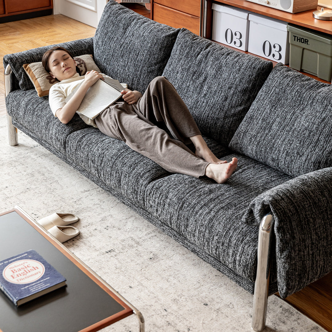 Cream boucle fabric 3 seater sofa song with context.