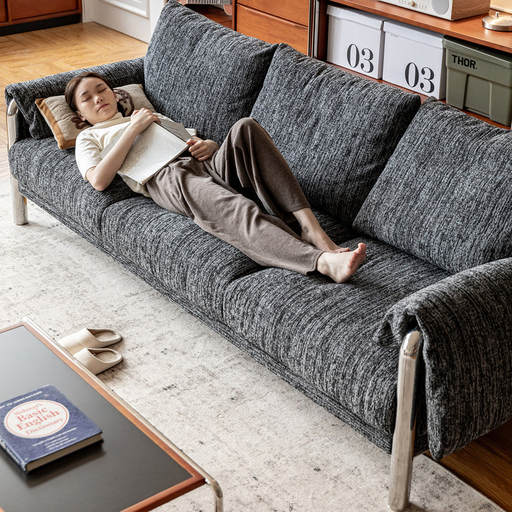 Cream boucle fabric 3 seater sofa song with context.