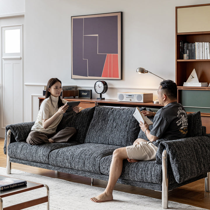 Cream boucle fabric 3 seater sofa song in panoramic view.