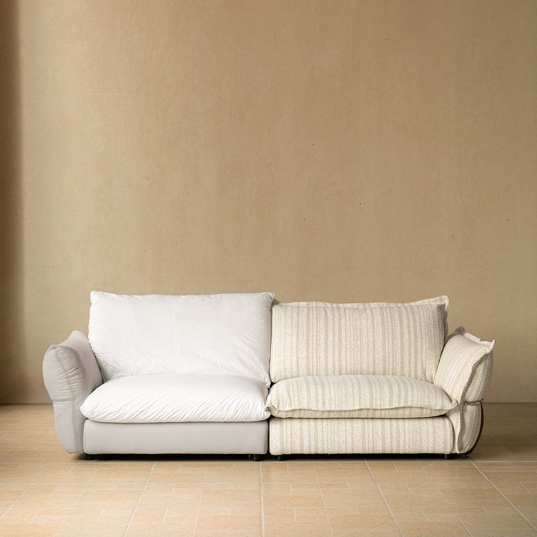 Cream boucle fabric 4 seater sofa circle in still life.