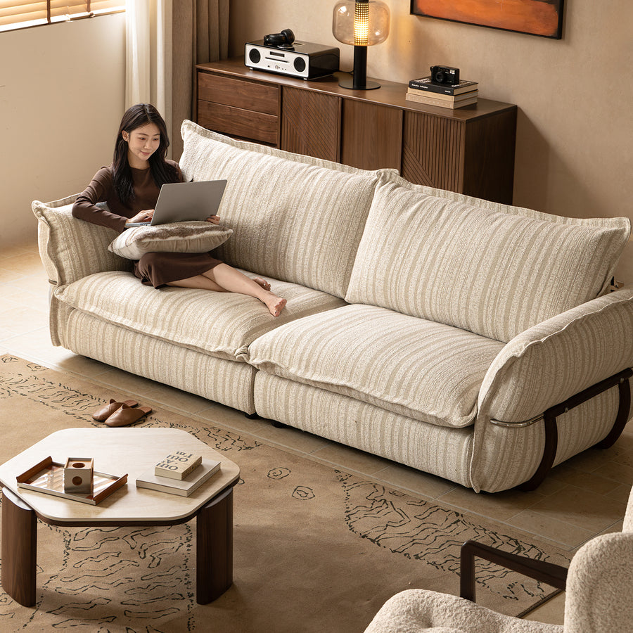 Cream boucle fabric 4 seater sofa circle in real life style.