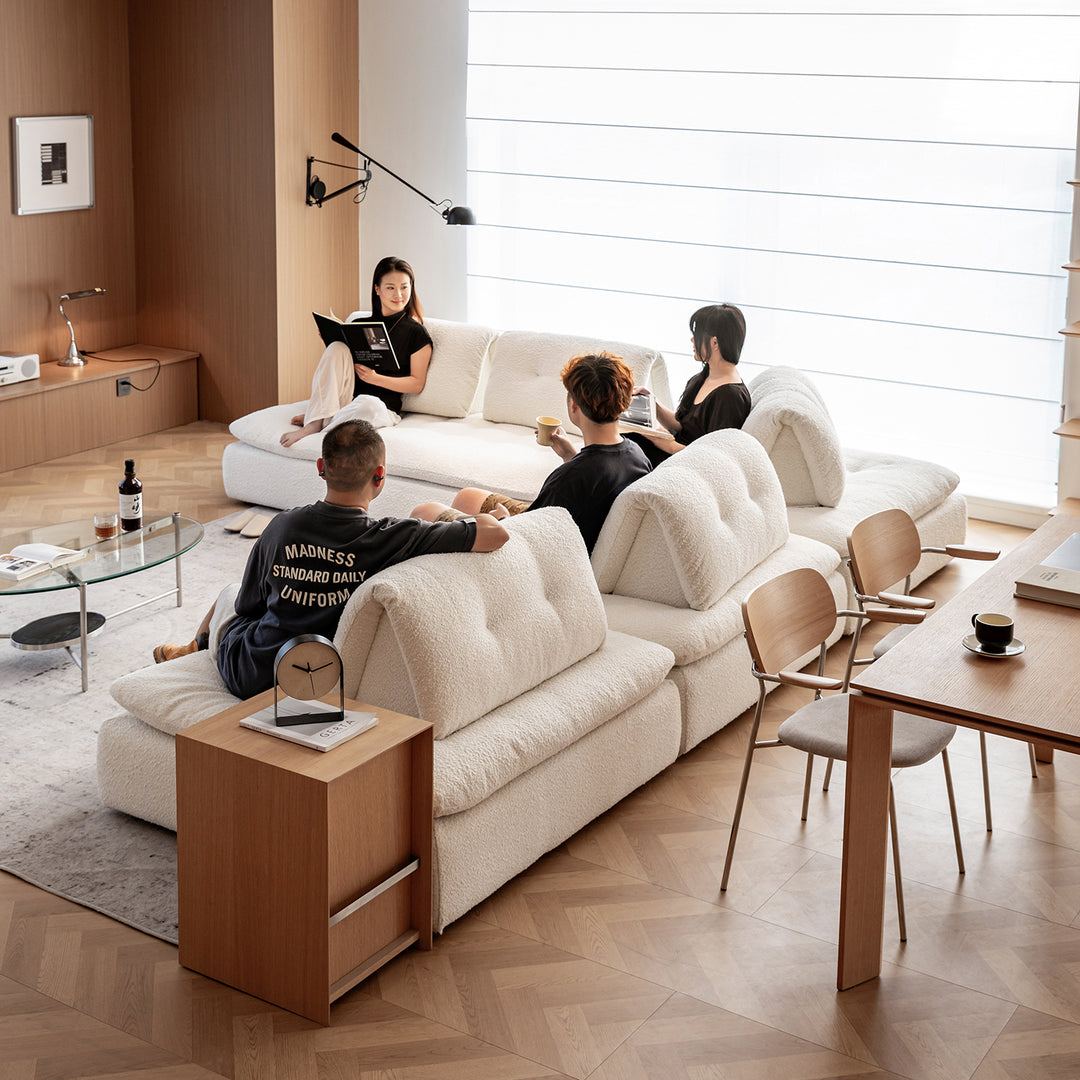 Cream boucle fabric modular 1 seater sofa bloc in panoramic view.