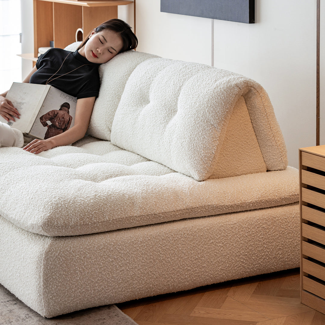 Cream boucle fabric modular 1 seater sofa bloc with context.