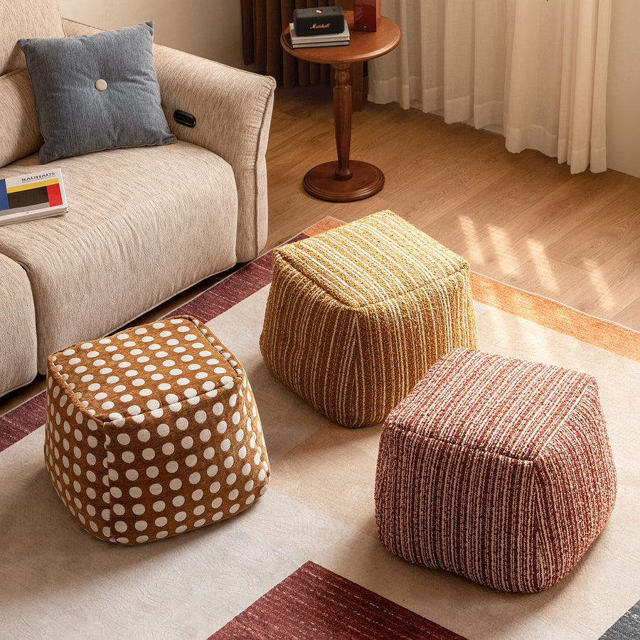 Cream boucle fabric ottoman carry primary product view.
