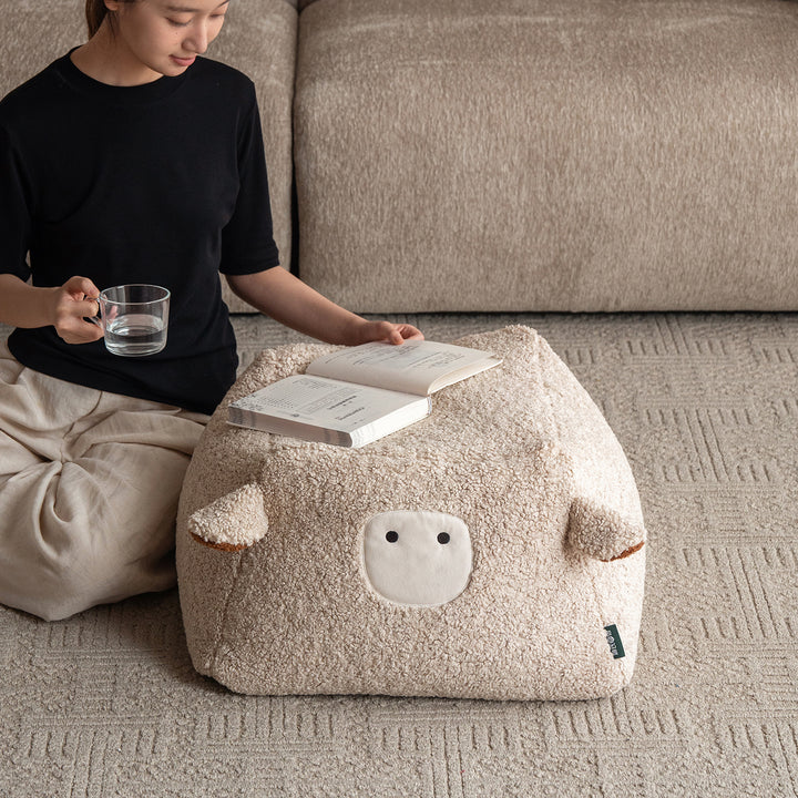 Cream boucle fabric ottoman sheep material variants.