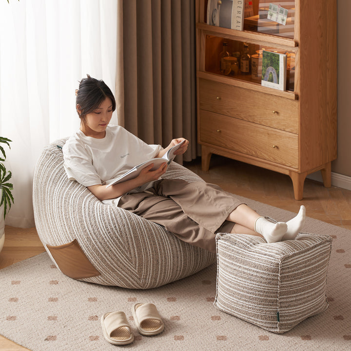 Cream chenille velvet fabric ottoman stripe with context.