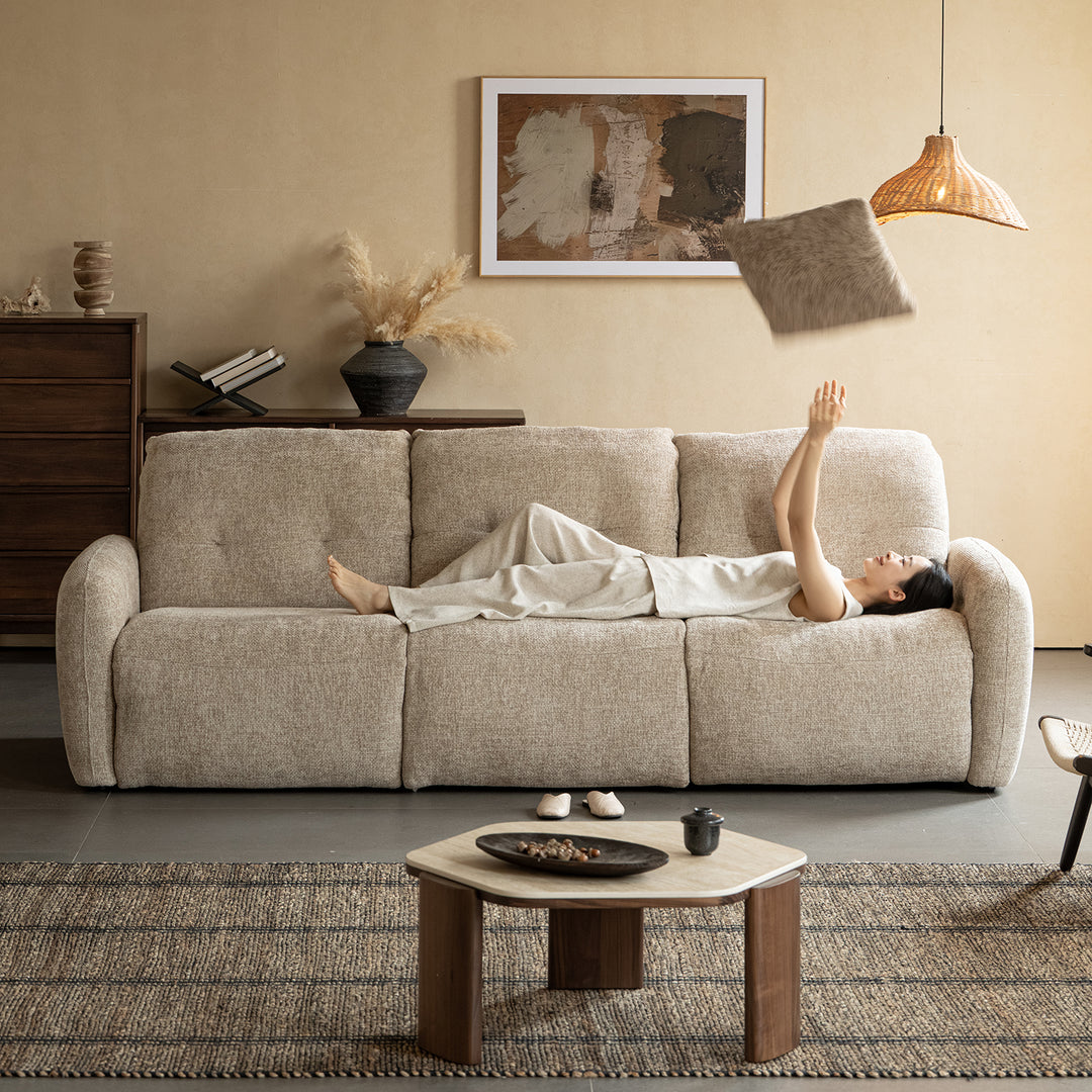 Cream chenille velvet fabric recliner 4 seater sofa mellow in close up details.