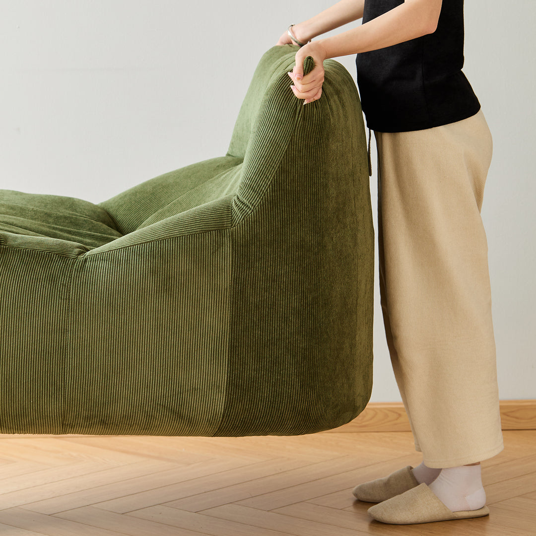 Cream corduroy velvet fabric 1 seater sofa kait in close up details.