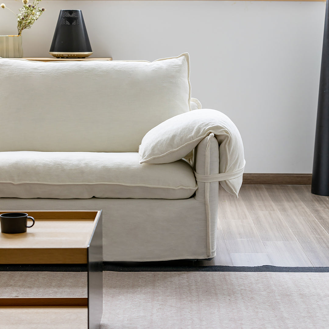 Cream cotton fabric 1 seater sofa folding ear primary product view.