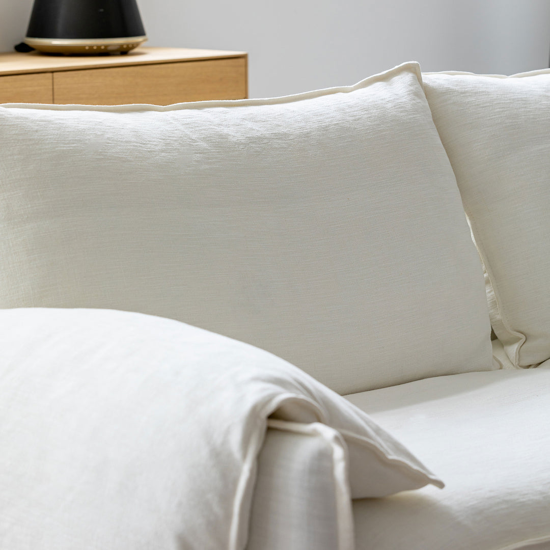 Cream cotton fabric 1 seater sofa folding ear with context.