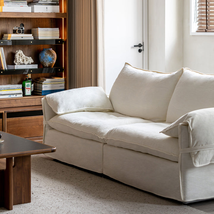 Cream cotton fabric 2 seater sofa folding ear environmental situation.