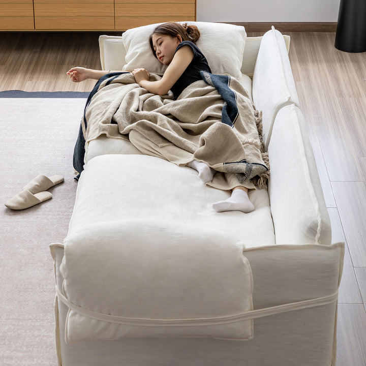 Cream cotton fabric 3 seater sofa folding ear in real life style.