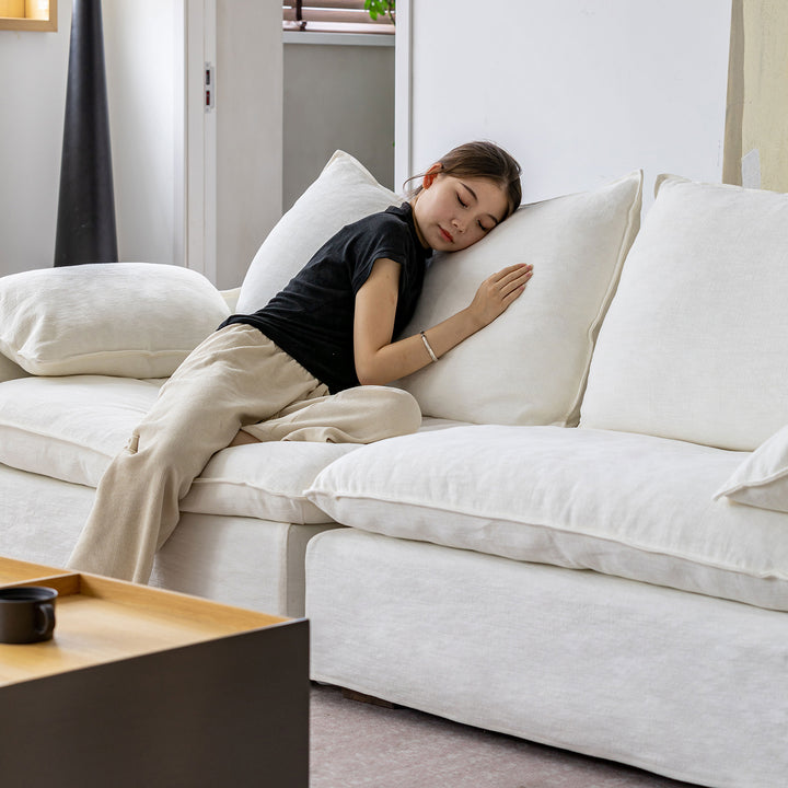 Cream cotton fabric 3 seater sofa folding ear with context.