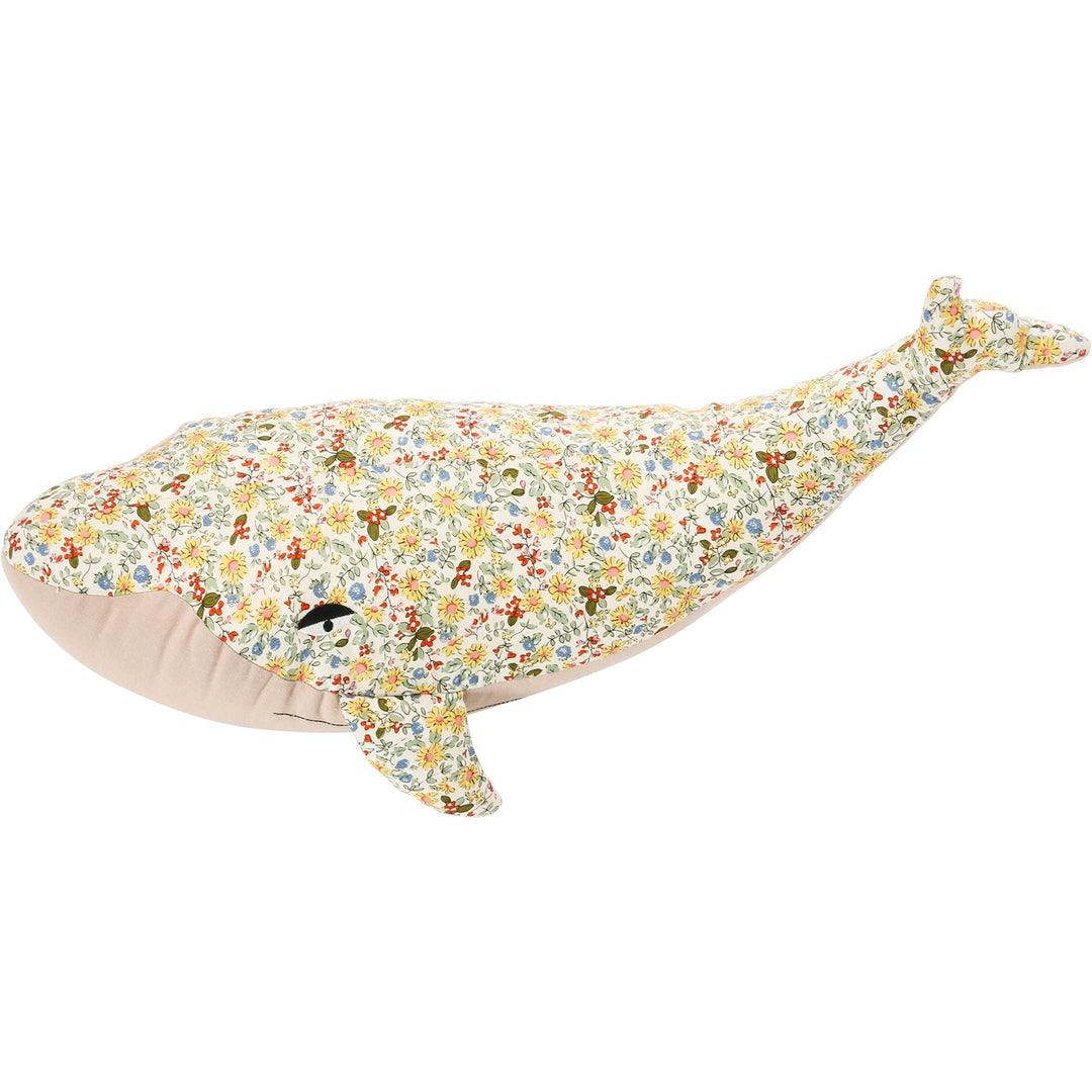 Detailed floral print plush whale bedroom decor in details.