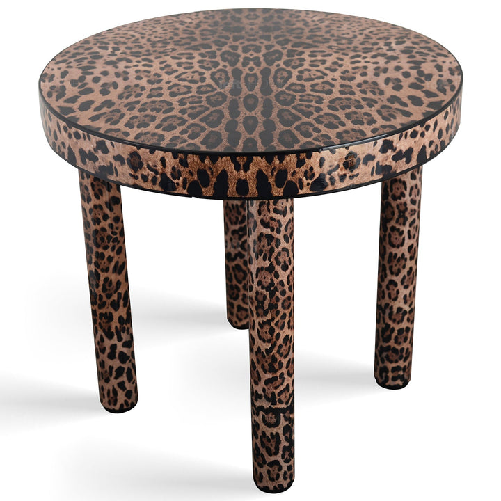 Eclectic wood coffee table leopard in close up details.
