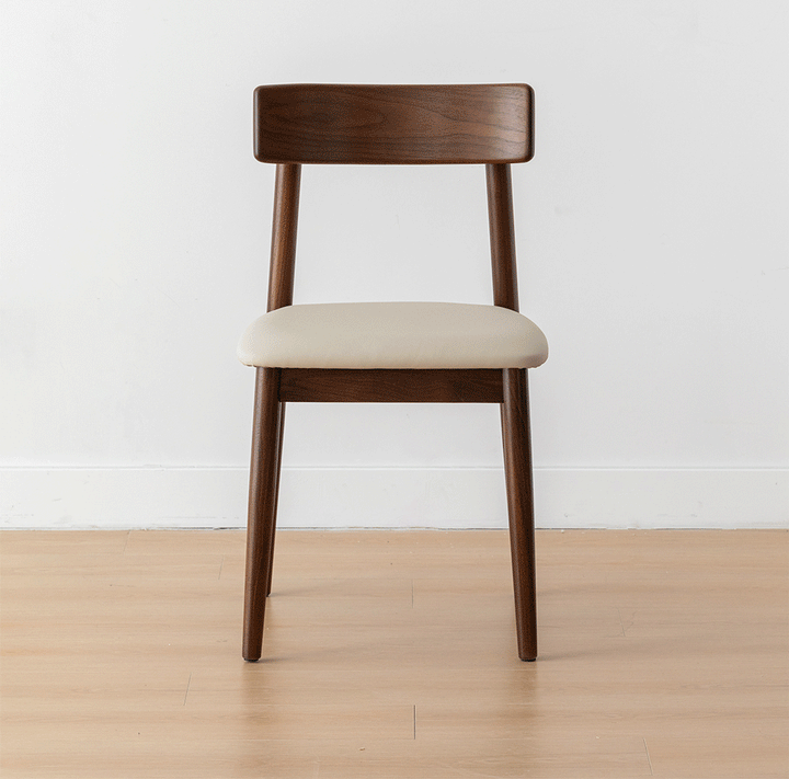 Japandi walnut wood microfiber leather dining chair green with context.