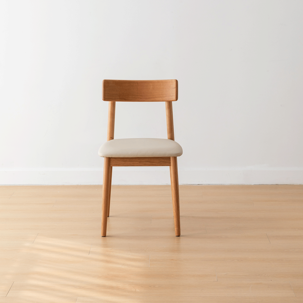 Scandinavian cherry wood mixed weave fabric dining chair green with context.