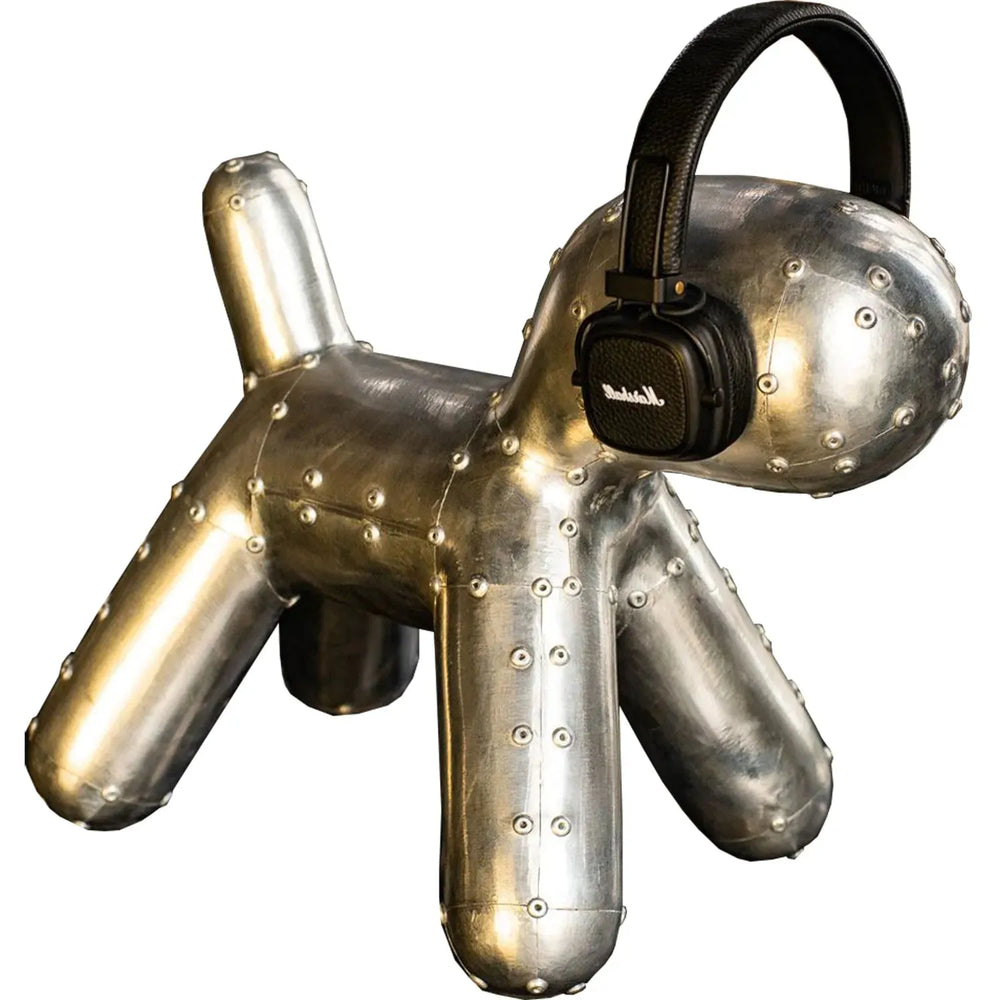 Industrial aluminium puppy dog decor in white background.