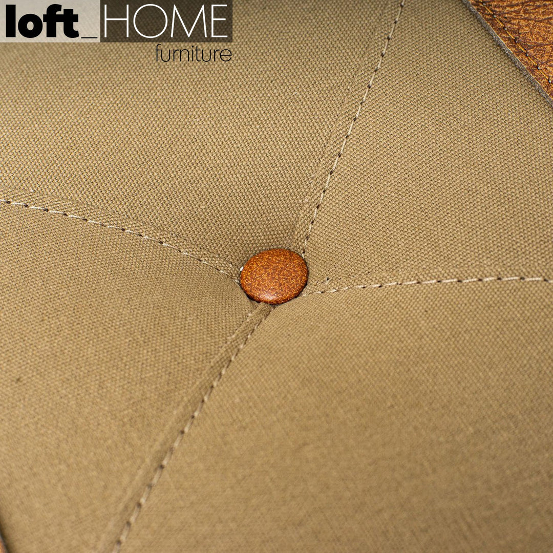 Industrial canvas ottoman stool travel in close up details.