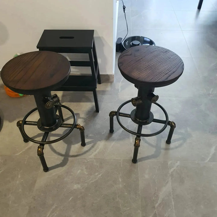 Industrial elm wood bar stool hydrant in panoramic view.