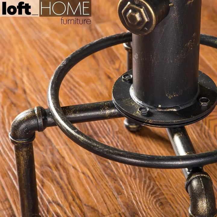 Industrial elm wood bar stool hydrant in close up details.