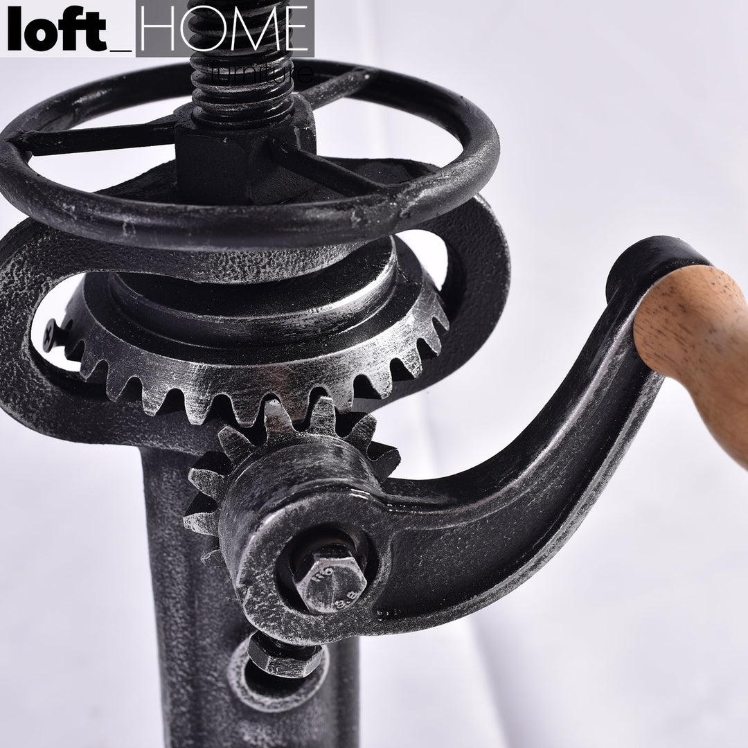 Industrial leather height adjustable stool gear in close up details.